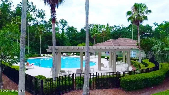 a front view of house with yard and outdoor seating