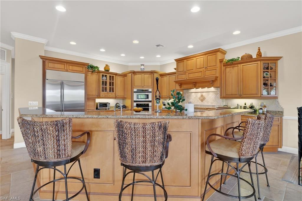 1964 Rialto Way Alva, FL 33920 - Photo 13 of 50 a kitchen with stainless steel appliances granite countertop a table and chairs