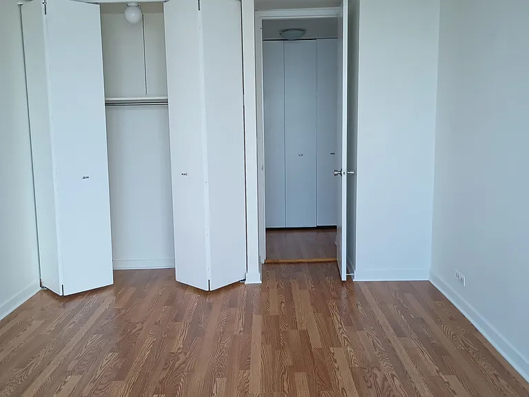 655 West Irving Park Road, Unit 5108 Chicago, IL 60613 - Photo 13 of 13 a view of empty room with wooden floor