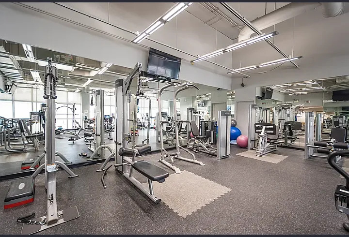 655 West Irving Park Road, Unit 5108 Chicago, IL 60613 - Photo 6 of 13 a view of a room with gym equipment