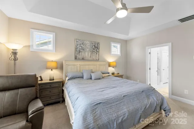 a bedroom with a bed and a couch