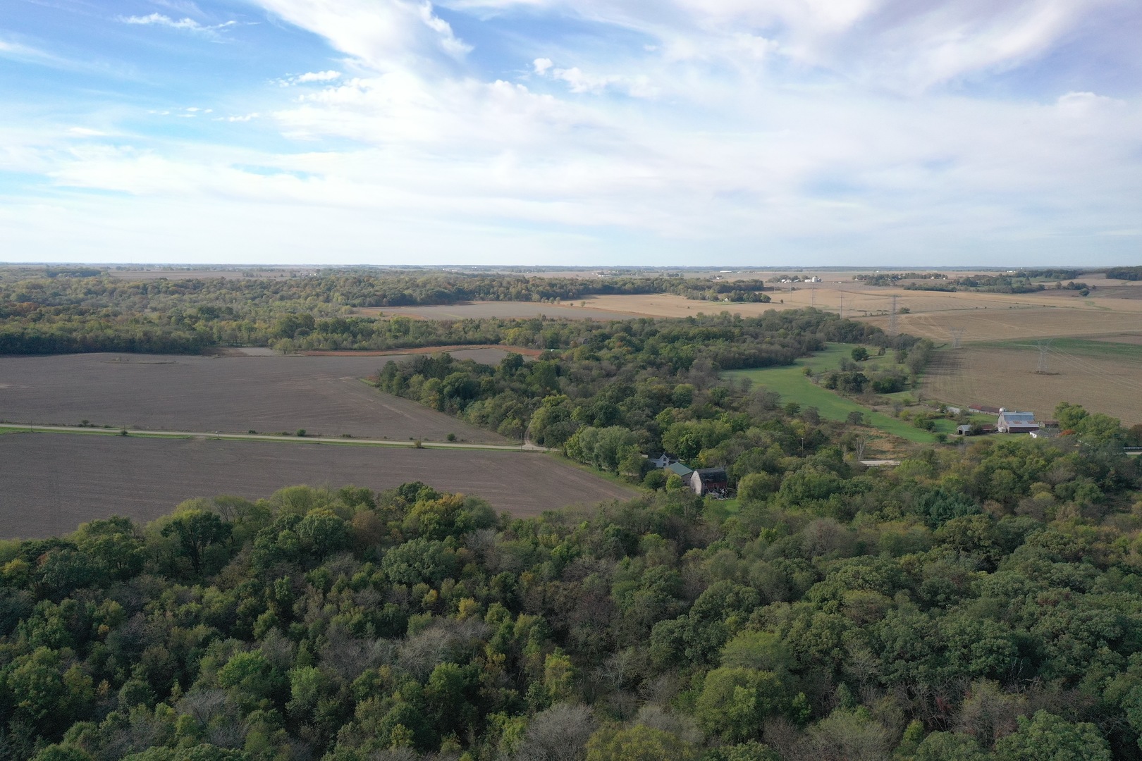 0 South Prairie Road Chana, IL 61015 - Photo 2 of 40 an aerial view of a city with lots of residential buildings and mountain view in back