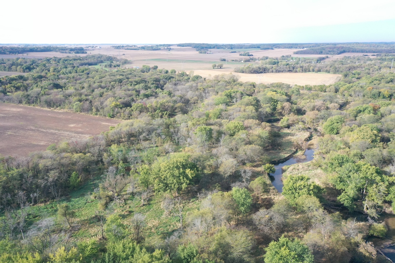 0 South Prairie Road Chana, IL 61015 - Photo 21 of 40 an aerial view of mountain with trees around
