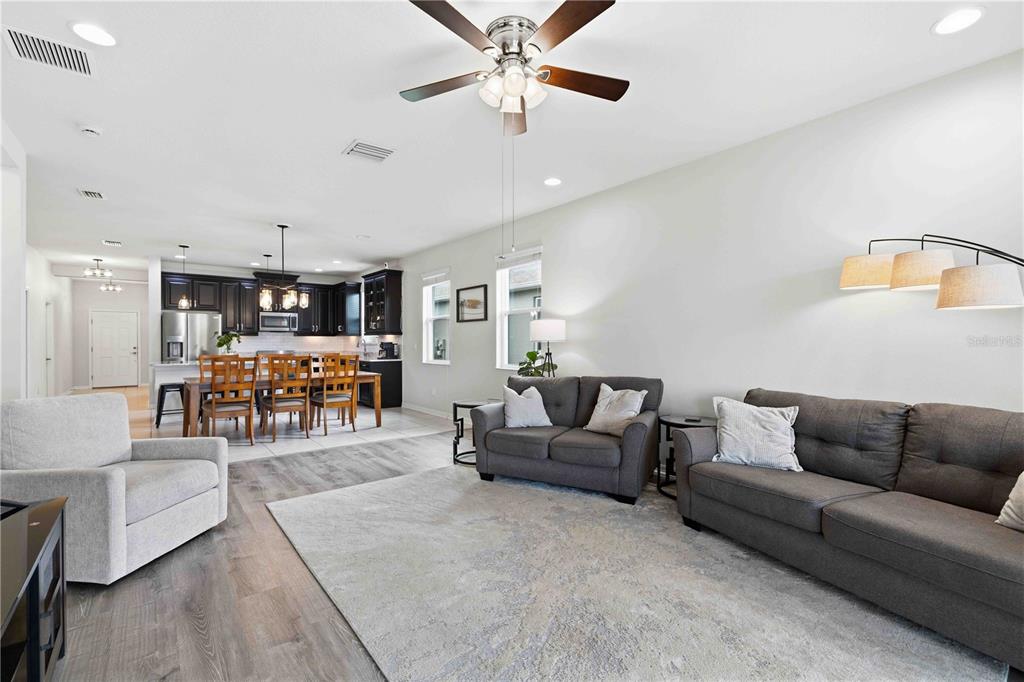 10920 79th Street East Parrish, FL 34219 - Photo 18 of 73 a living room with furniture and kitchen view
