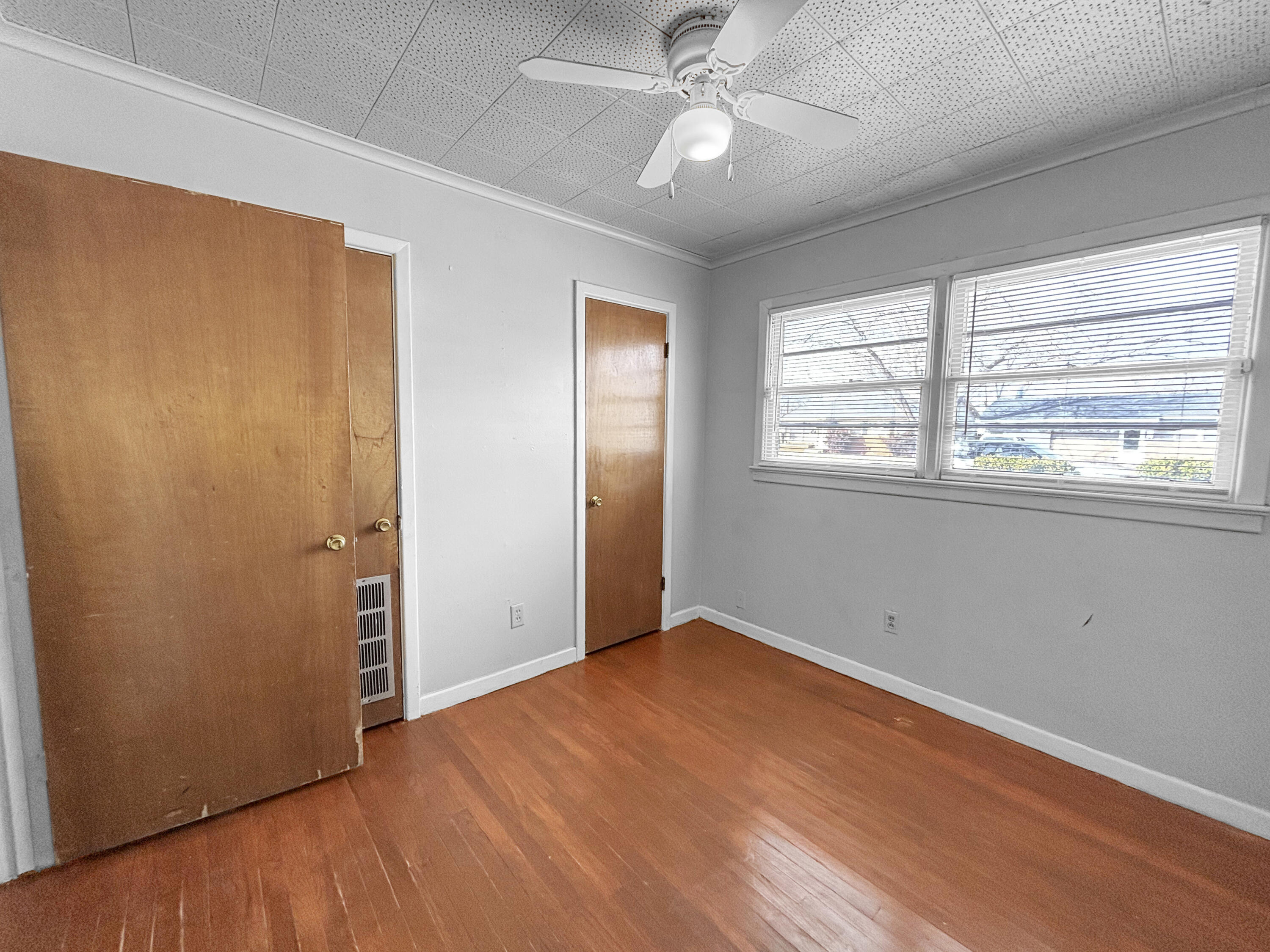4411 45th Street Lubbock, TX 79414 - Photo 23 of 44 a view of empty room with wooden floor and fan