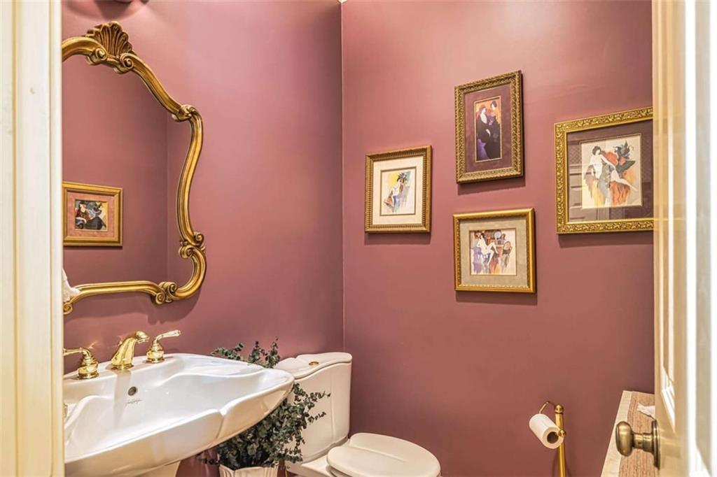 35 Torrey Pines Court Newnan, GA 30265 - Photo 14 of 54 a bathroom with a sink mirror and a toilet