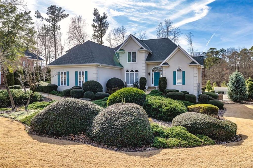 35 Torrey Pines Court Newnan, GA 30265 - Photo 2 of 54 a view of a front of house with large windows