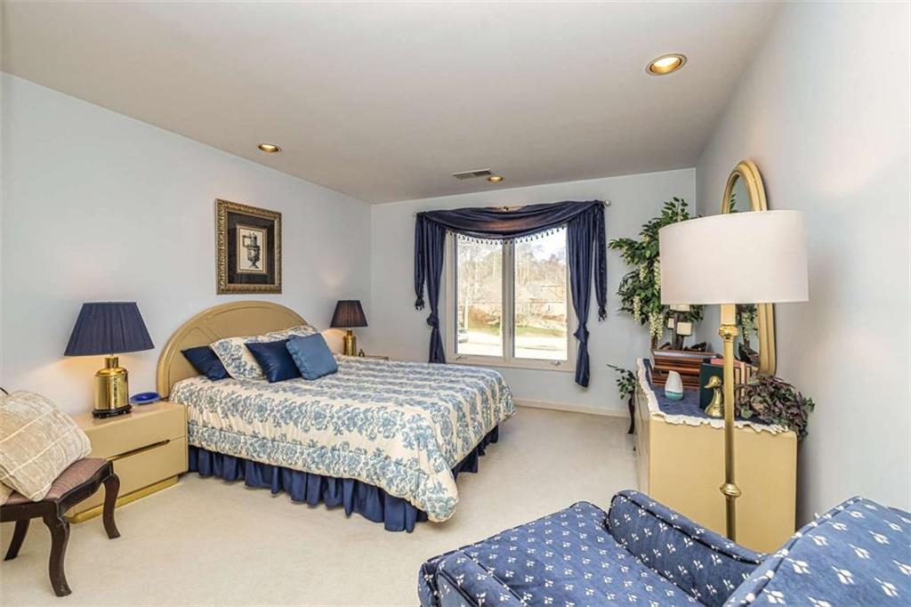 35 Torrey Pines Court Newnan, GA 30265 - Photo 29 of 54 a bedroom with a bed and wooden floor