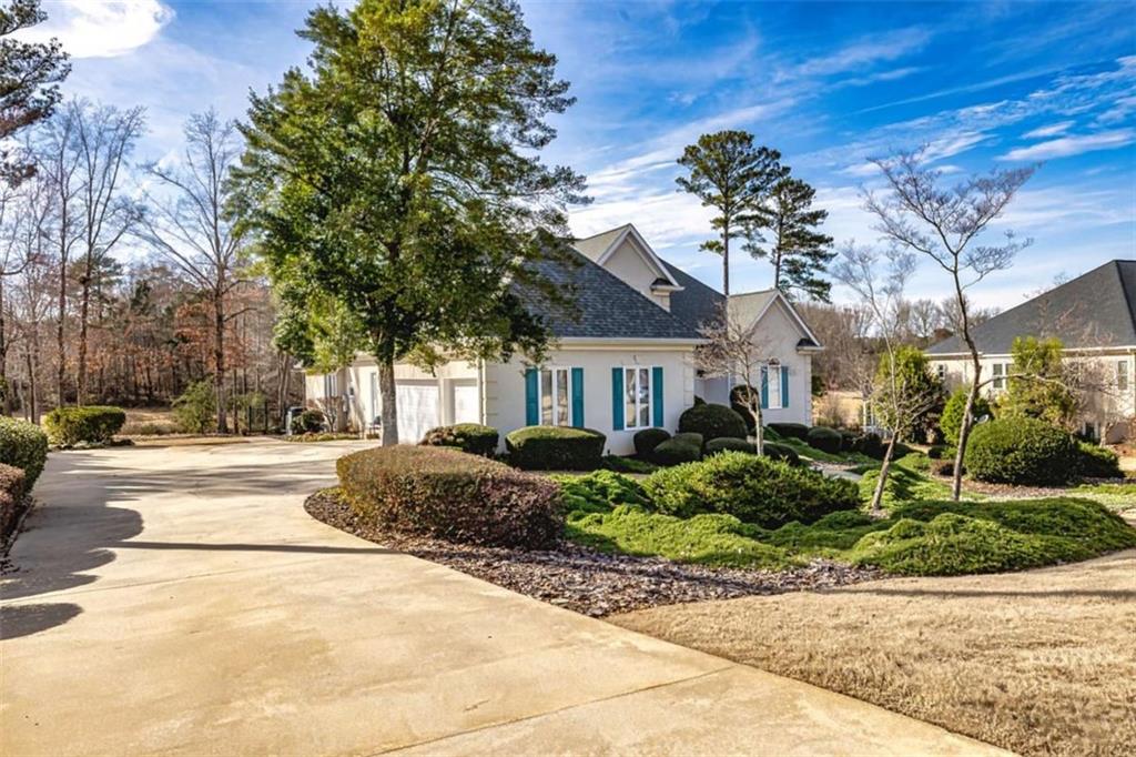 35 Torrey Pines Court Newnan, GA 30265 - Photo 3 of 54 a front view of a house with a yard