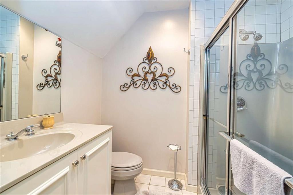 35 Torrey Pines Court Newnan, GA 30265 - Photo 34 of 54 a bathroom with a sink toilet and shower