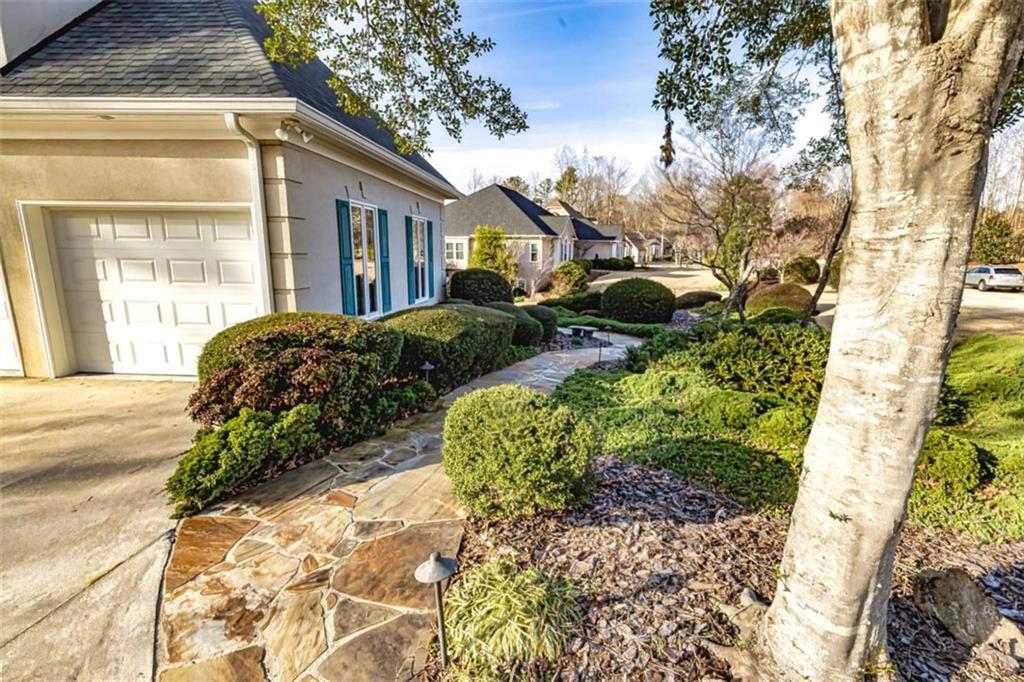 35 Torrey Pines Court Newnan, GA 30265 - Photo 5 of 54 a front view of a house with garden