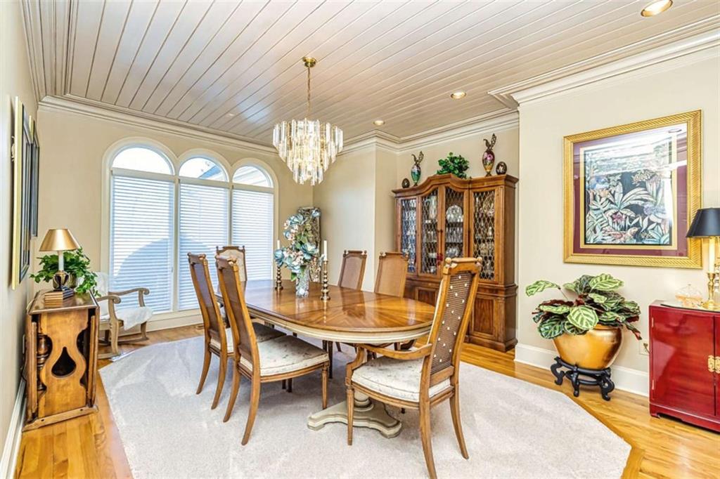 35 Torrey Pines Court Newnan, GA 30265 - Photo 8 of 54 a view of a dining room with furniture and a chandelier