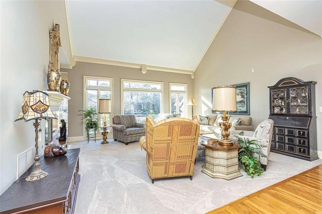 35 Torrey Pines Court Newnan, GA 30265 - Photo 10 of 54 a living room with fireplace furniture and a large window