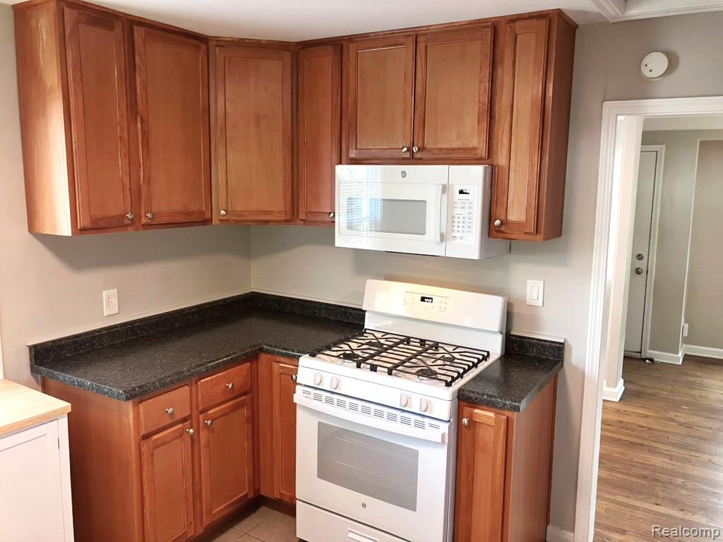 2034 Martin Road Ferndale, MI 48220 - Photo 12 of 18 Updated kitchen comes with brand new gas stove, refrigerator, microwave & countertop dishwasher.
