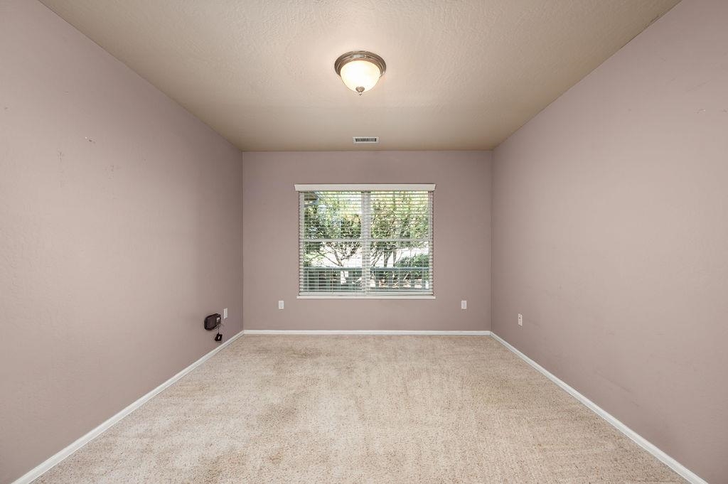 710 Comstock Drive Fruita, CO 81521 - Photo 17 of 25 an empty room with a empty space and windows