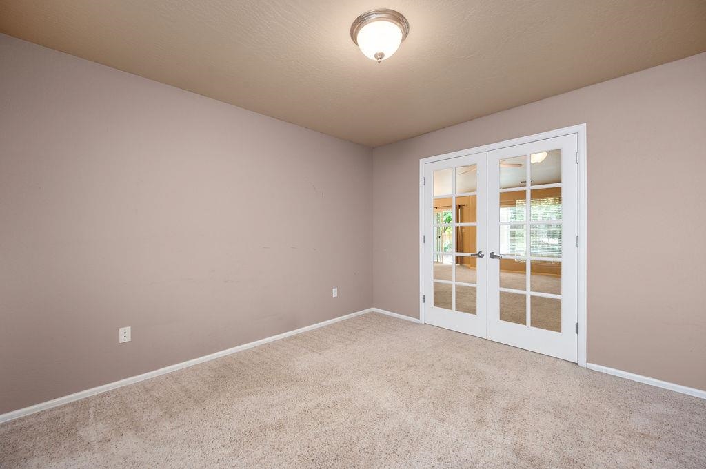 710 Comstock Drive Fruita, CO 81521 - Photo 18 of 25 an empty room with windows