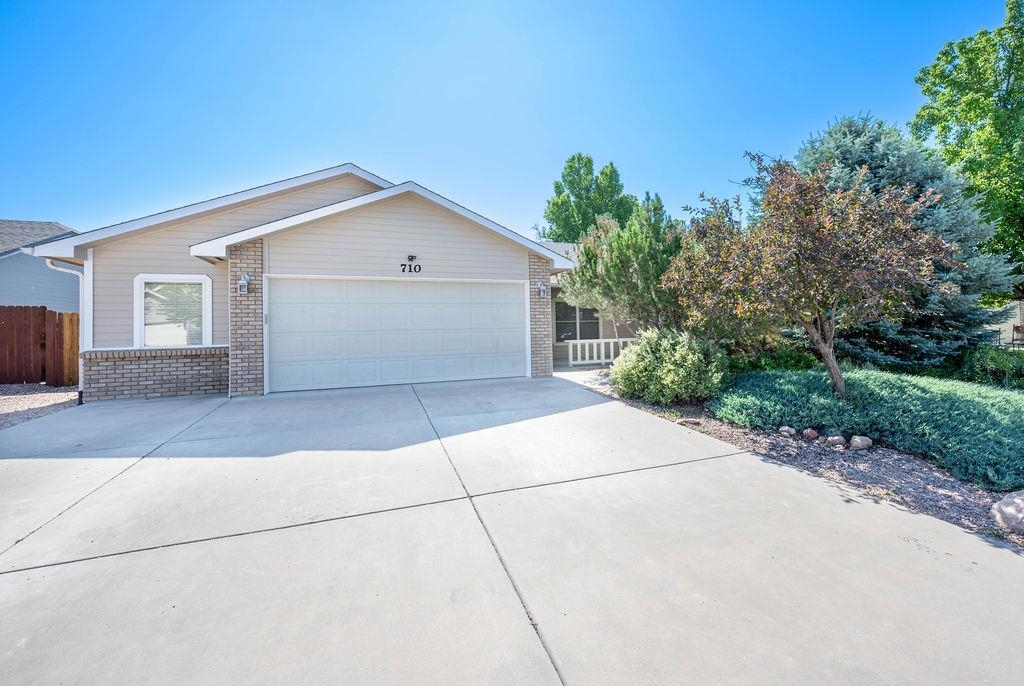 710 Comstock Drive Fruita, CO 81521 - Photo 2 of 25 a view of garage and yard