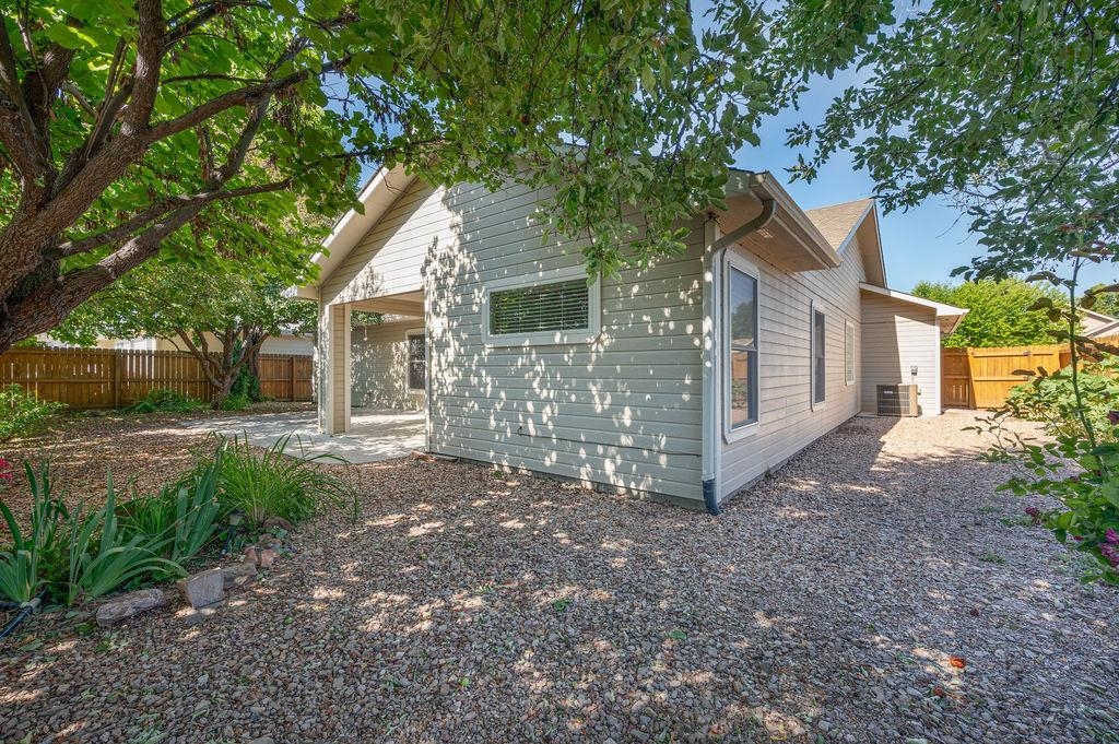 710 Comstock Drive Fruita, CO 81521 - Photo 24 of 25 a view of a house with a yard and large tree