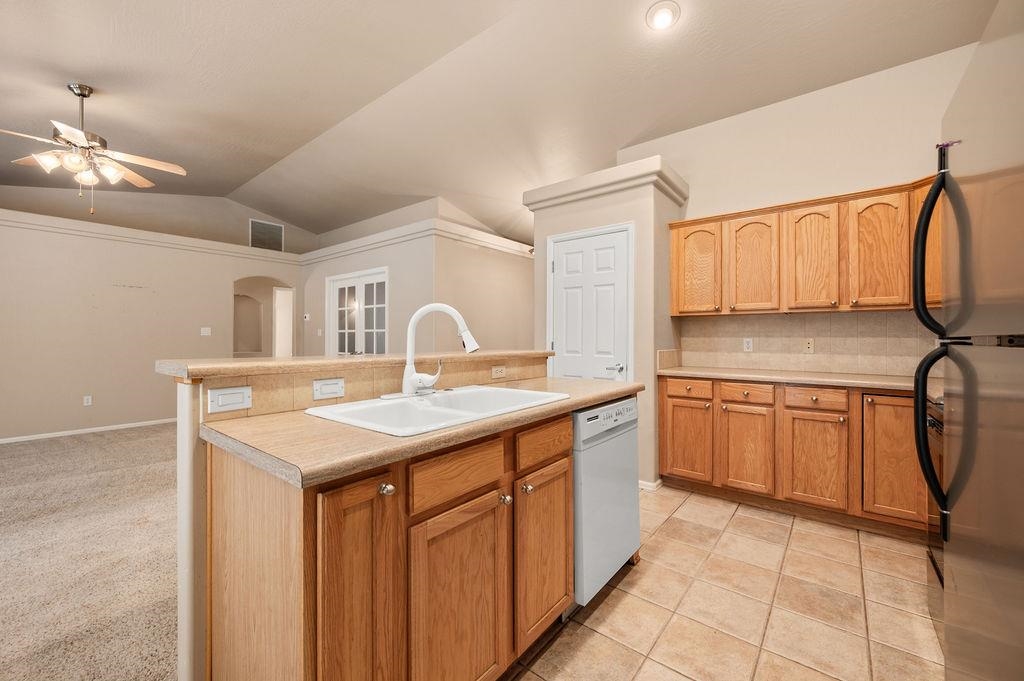 710 Comstock Drive Fruita, CO 81521 - Photo 5 of 25 a kitchen with a sink a cabinets and wooden floor
