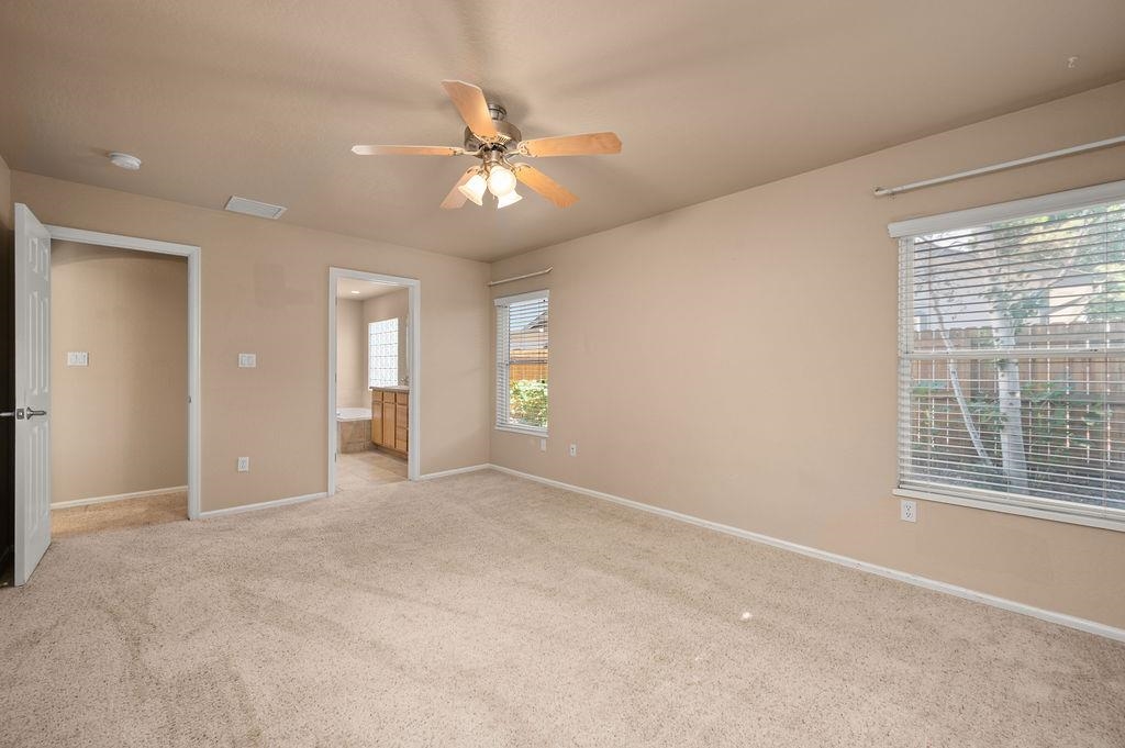 710 Comstock Drive Fruita, CO 81521 - Photo 10 of 25 a view of an empty room with a window