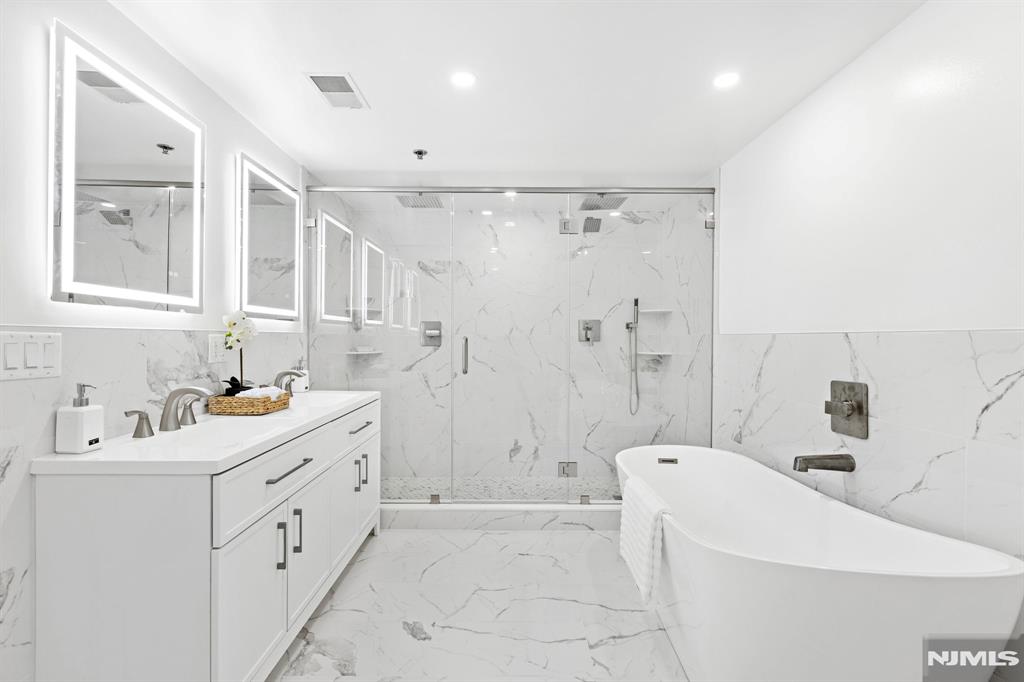 302 Smith Court Edgewater, NJ 07020 - Photo 20 of 34 a bathroom with a sink a toilet and shower