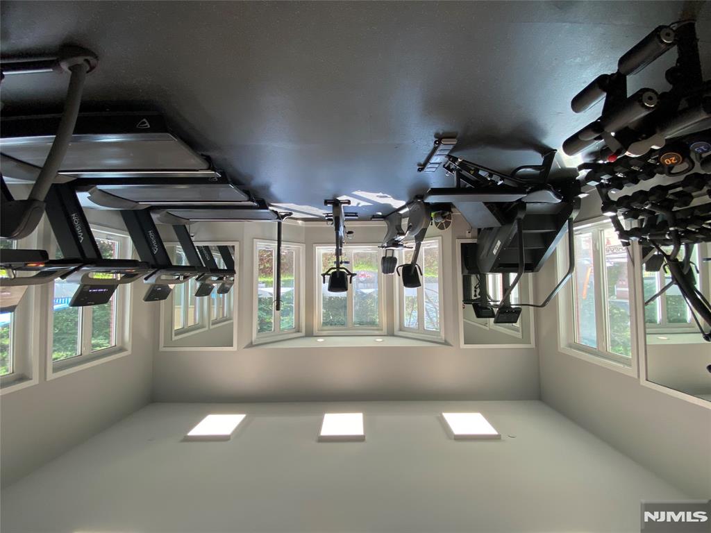 302 Smith Court Edgewater, NJ 07020 - Photo 30 of 34 a view of a livingroom with gym equipment