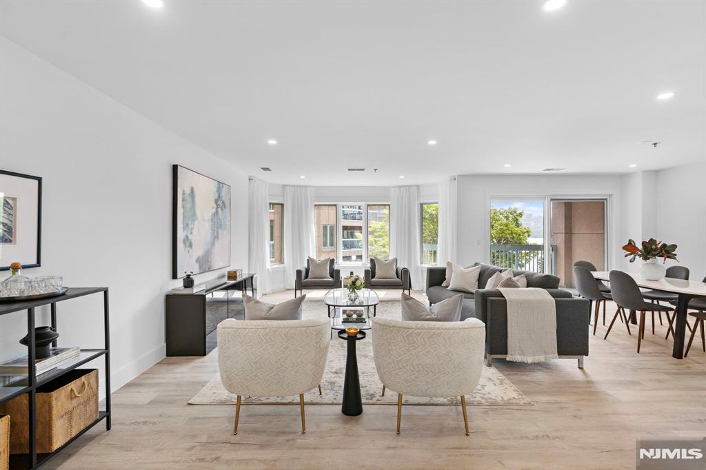 302 Smith Court Edgewater, NJ 07020 - Photo 4 of 34 a living room with furniture and wooden floor