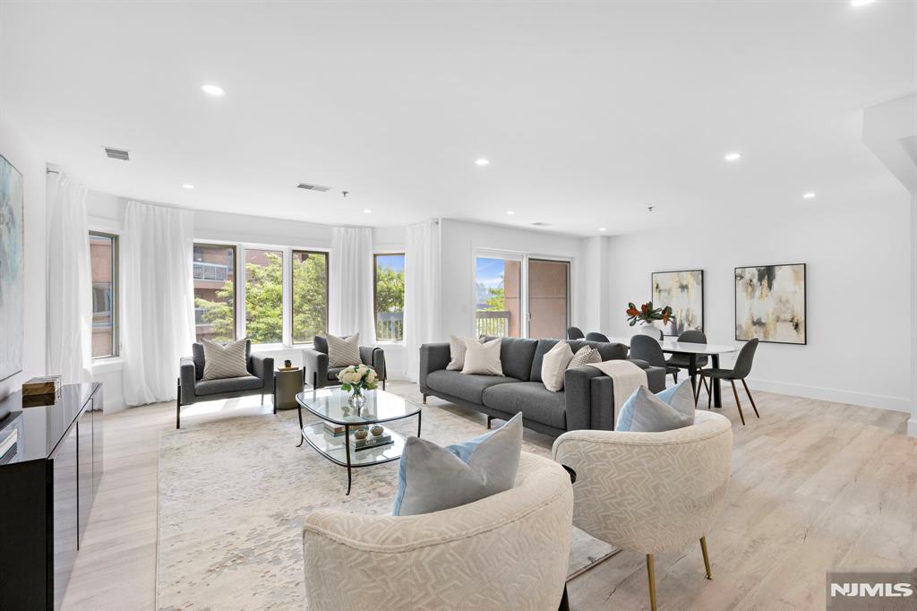 302 Smith Court Edgewater, NJ 07020 - Photo 8 of 34 a living room with furniture and a large window