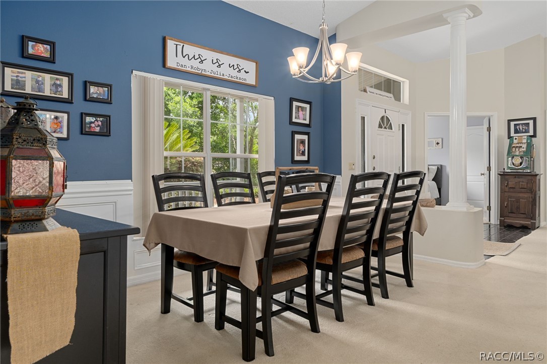 2460 West Pine Ridge Boulevard Beverly Hills, FL 34465 - Photo 14 of 47 a view of a dining room with furniture window and outside view