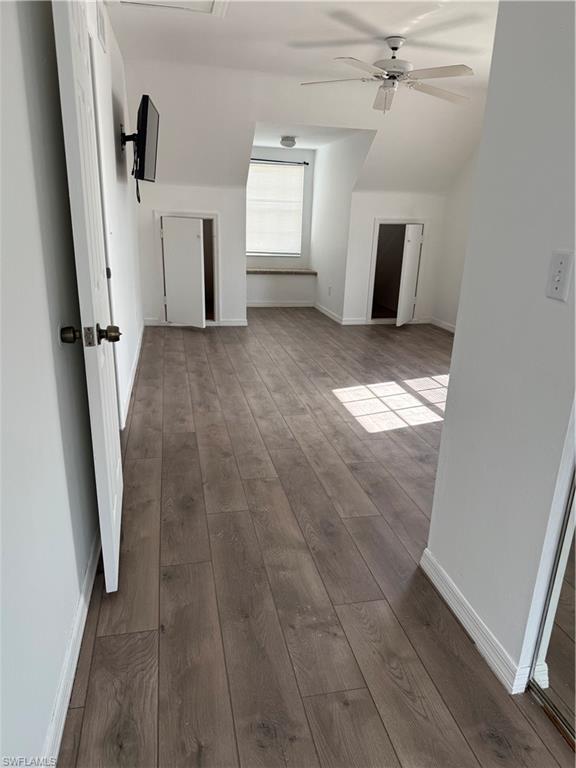 4211 Cindy Avenue Naples, FL 34112 - Photo 23 of 26 wooden floor in an empty room with a fireplace