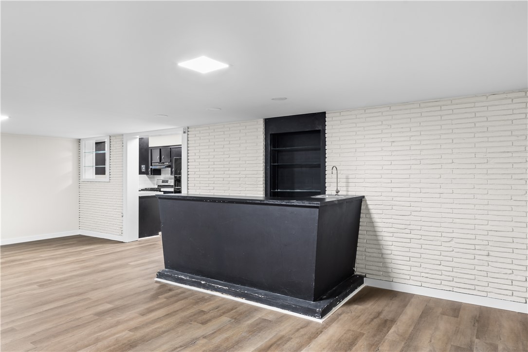 4402 Dolphin Place Corpus Christi, TX 78411 - Photo 16 of 27 wooden floor in an empty room with a window