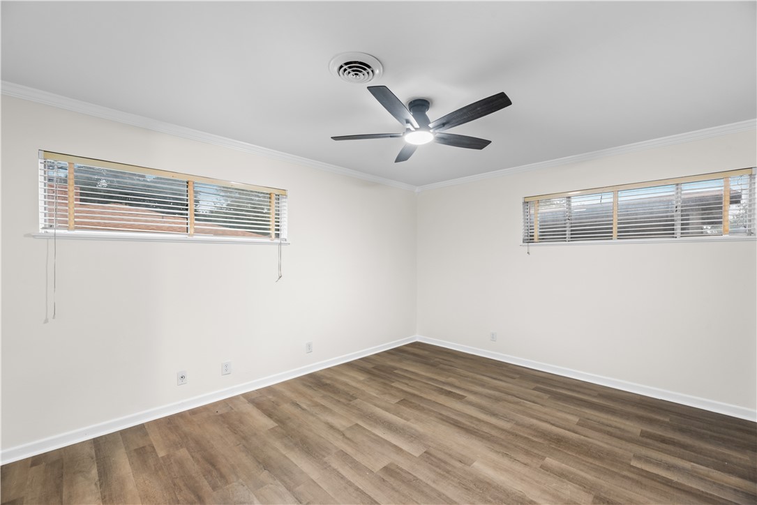 4402 Dolphin Place Corpus Christi, TX 78411 - Photo 18 of 27 a view of a big room with wooden floor and windows