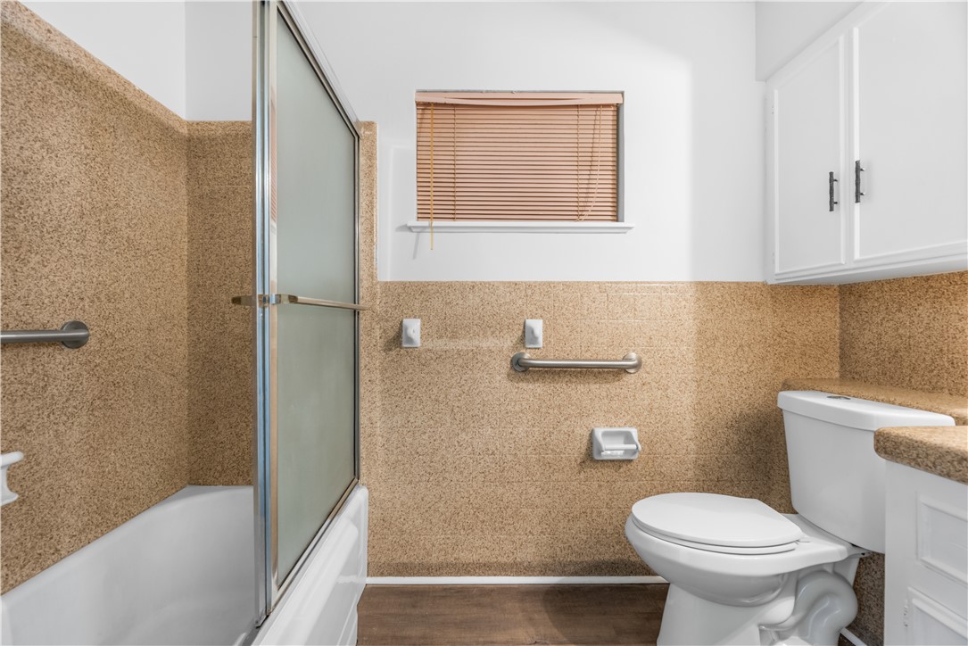 4402 Dolphin Place Corpus Christi, TX 78411 - Photo 25 of 27 a bathroom with a toilet and a sink