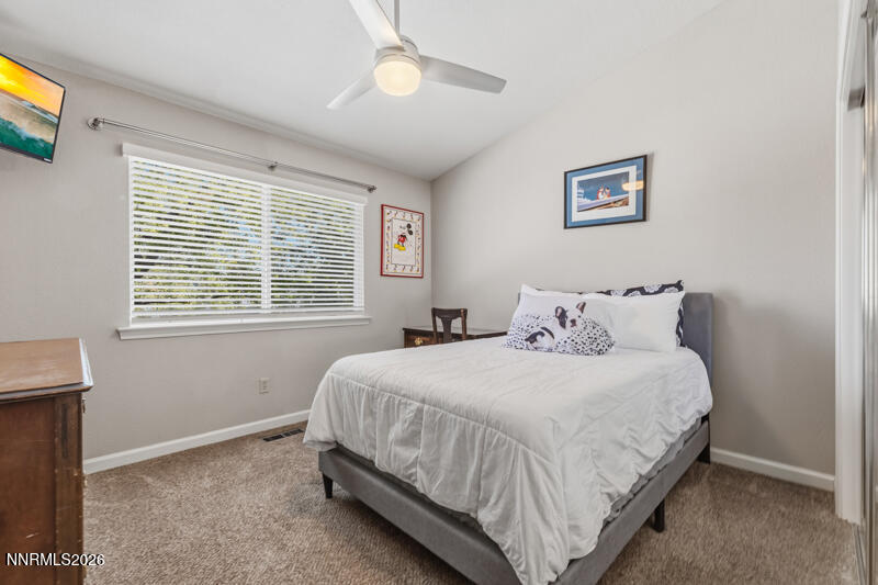 675 College Drive Reno, NV 89503 - Photo 21 of 30 a bedroom with bed and a window