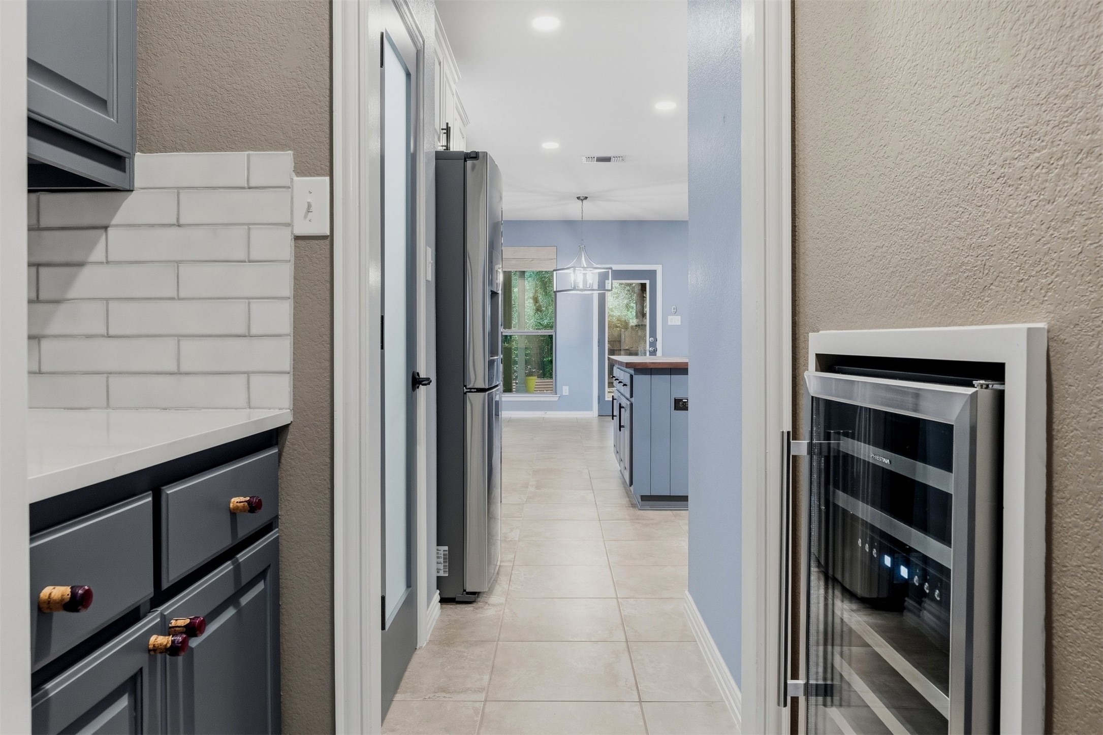 3935 Bowstring Bend Cedar Park, TX 78613 - Photo 8 of 39 This convenient pass-through includes a built-in wine fridge, making it easy to grab a drink while transitioning from work to dinner