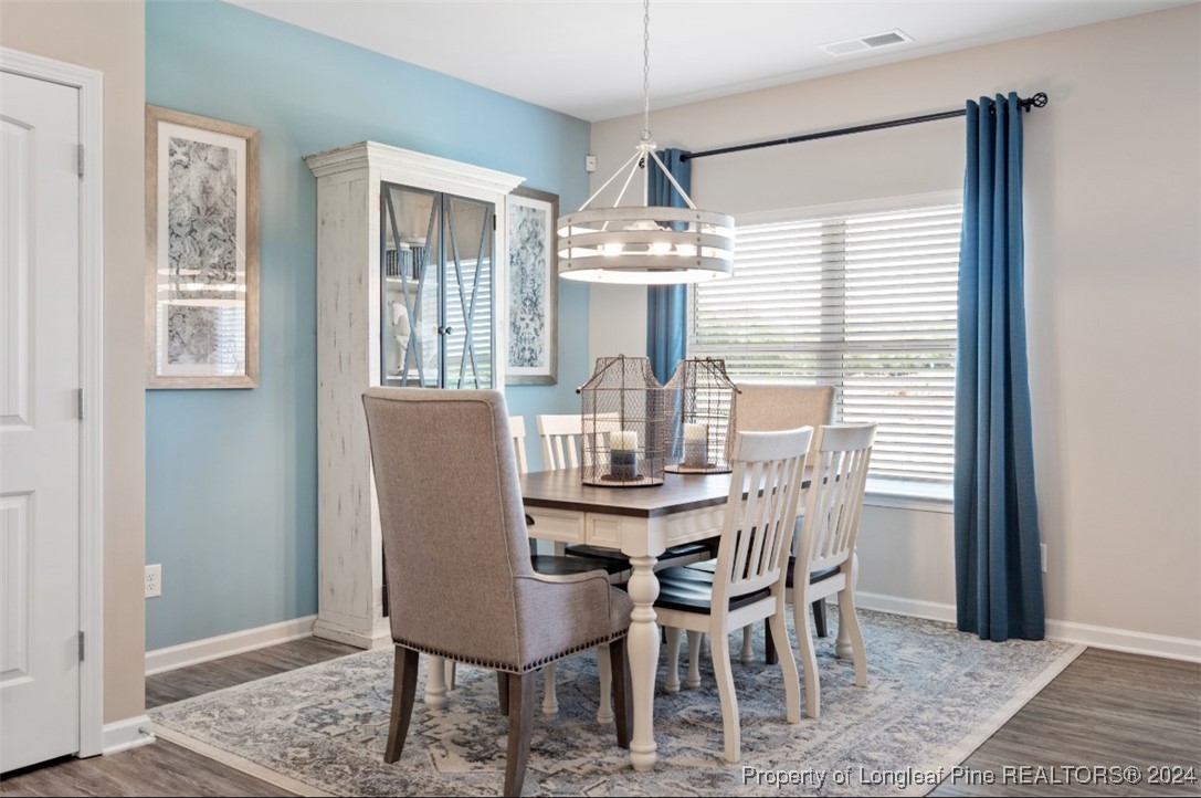 1594 Old Barn Road Fayetteville, NC 28312 - Photo 12 of 18 a dining room with furniture and window