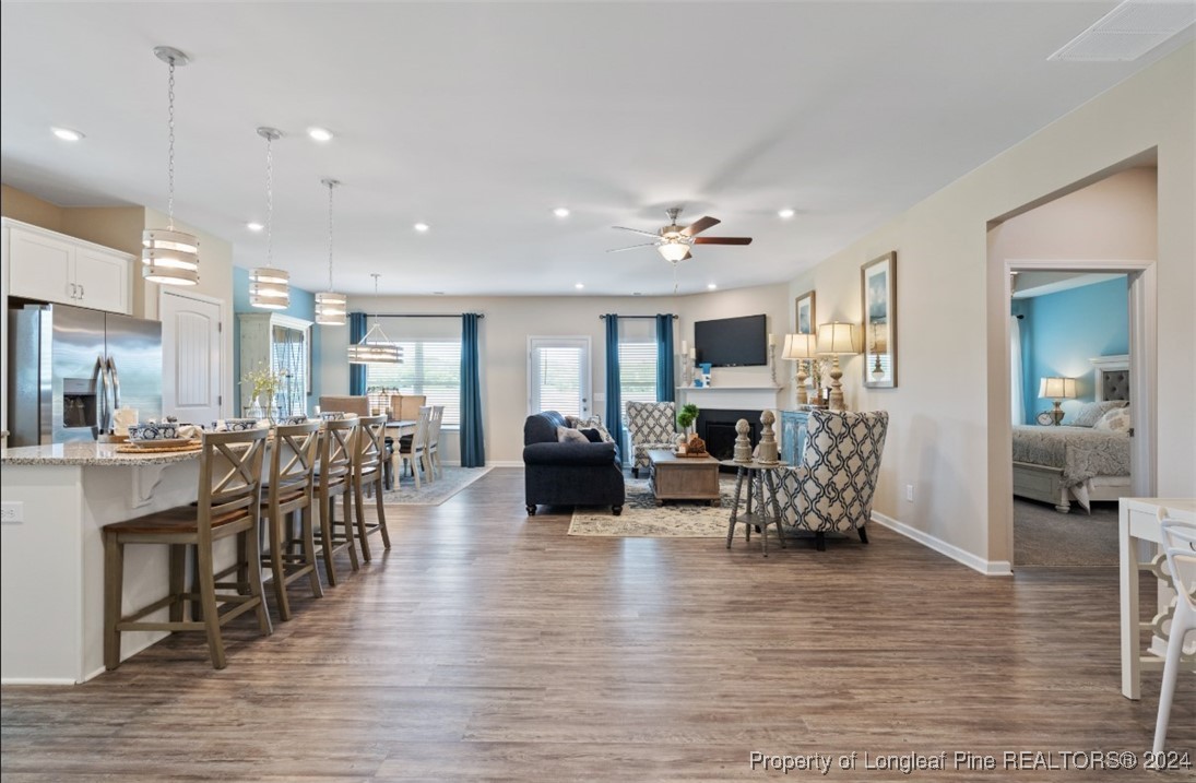 1594 Old Barn Road Fayetteville, NC 28312 - Photo 13 of 18 a living room with fireplace furniture and a wooden floor