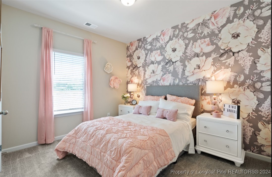 1594 Old Barn Road Fayetteville, NC 28312 - Photo 16 of 18 a bedroom with a bed and a window