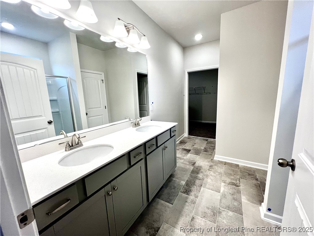 1594 Old Barn Road Fayetteville, NC 28312 - Photo 7 of 18 a bathroom with a double vanity sink mirror and shower