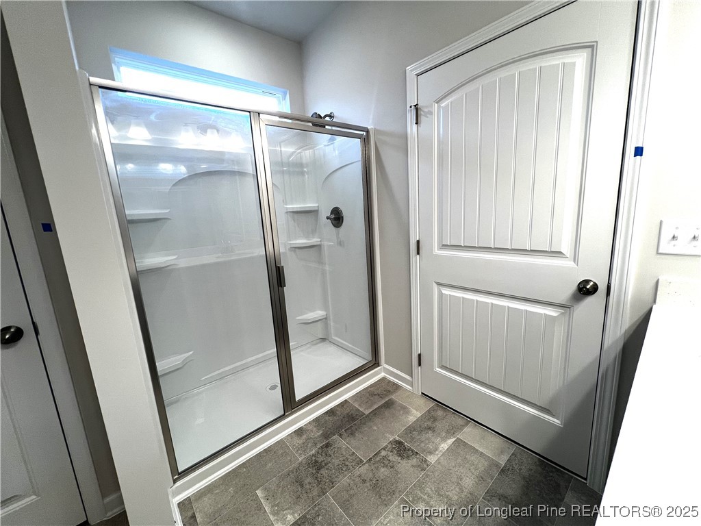1594 Old Barn Road Fayetteville, NC 28312 - Photo 8 of 18 a bathroom with a glass door shower