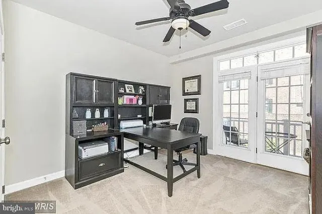 a workspace with furniture and a window