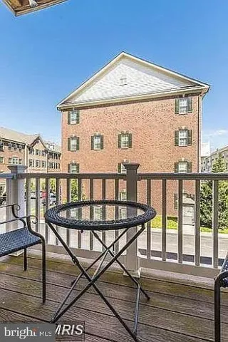 a front view of a house with wooden stairs