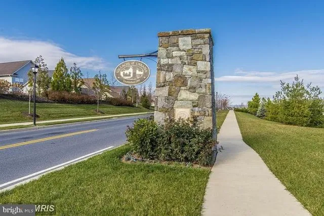 a view of a house with a yard and plants