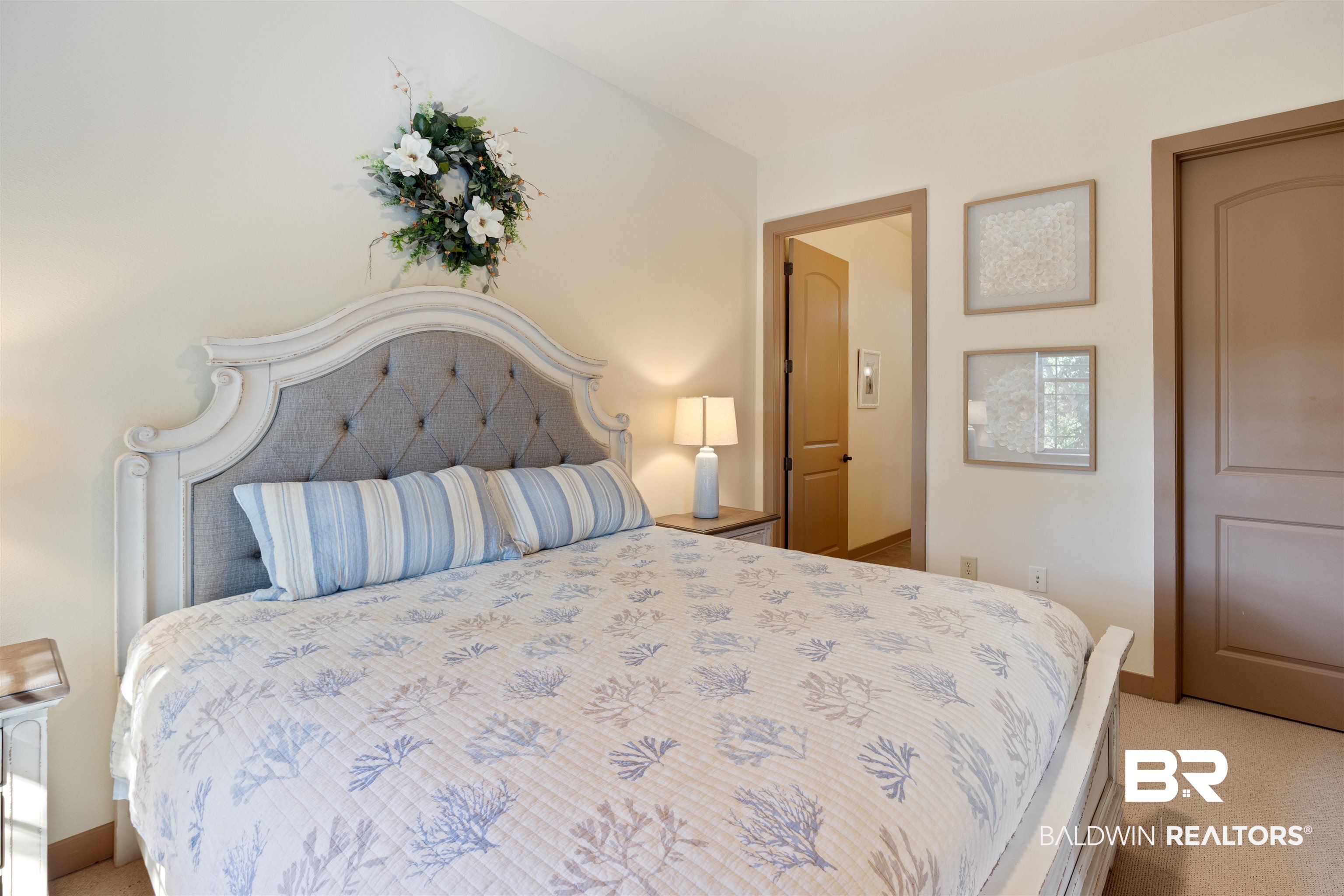 1430 Regency Road, Unit B201 Gulf Shores, AL 36542 - Photo 23 of 59 Bedroom with light colored carpet and baseboards