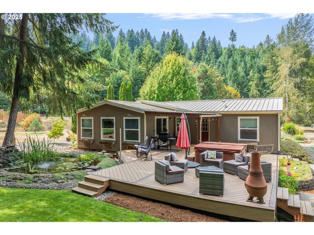 a view of a house with backyard sitting area and garden