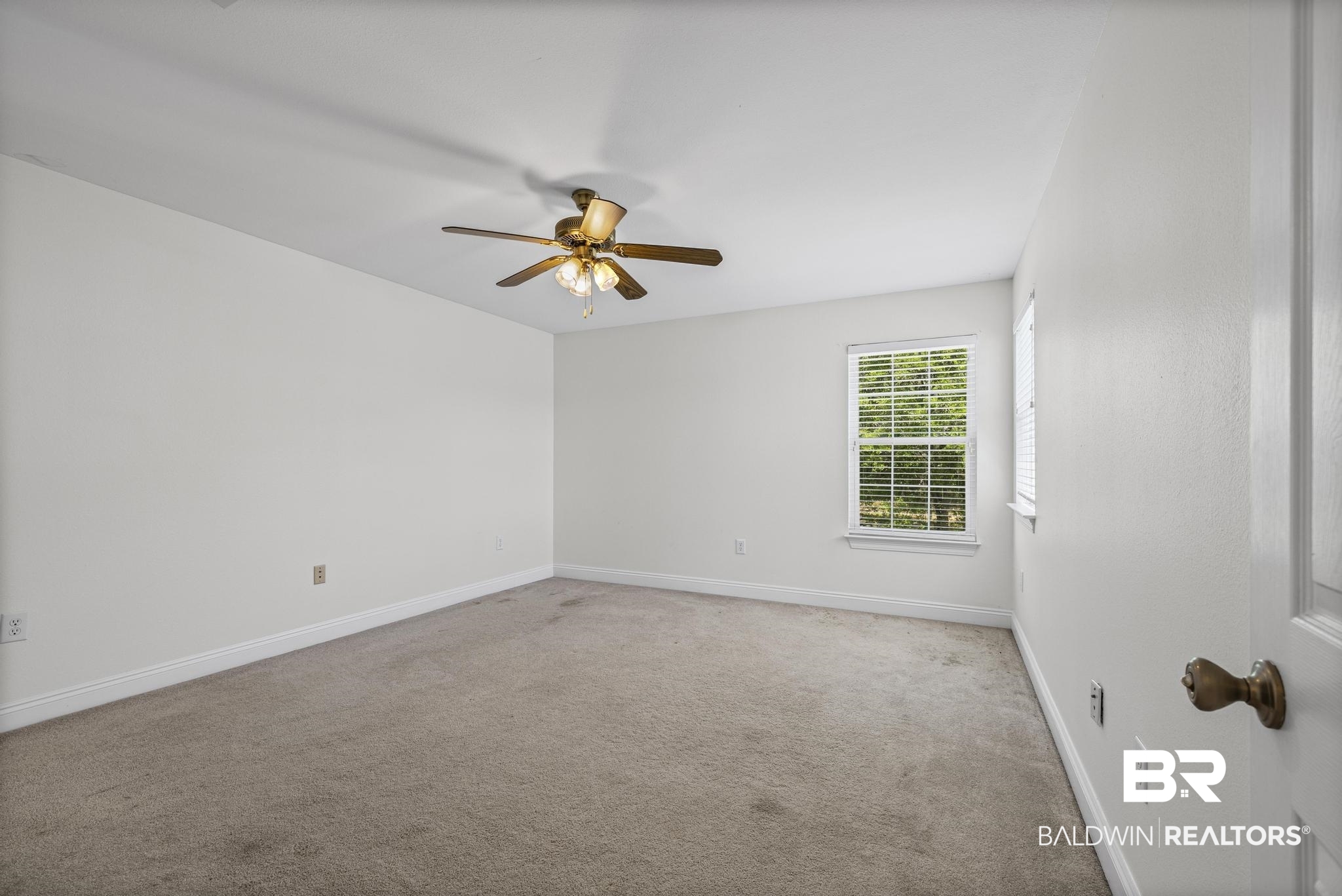 32875 Faircloth Road Lillian, AL 36549 - Photo 44 of 85 Carpeted spare room with ceiling fan and baseboards