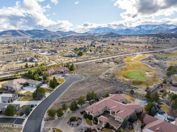 an aerial view of residential houses with outdoor space