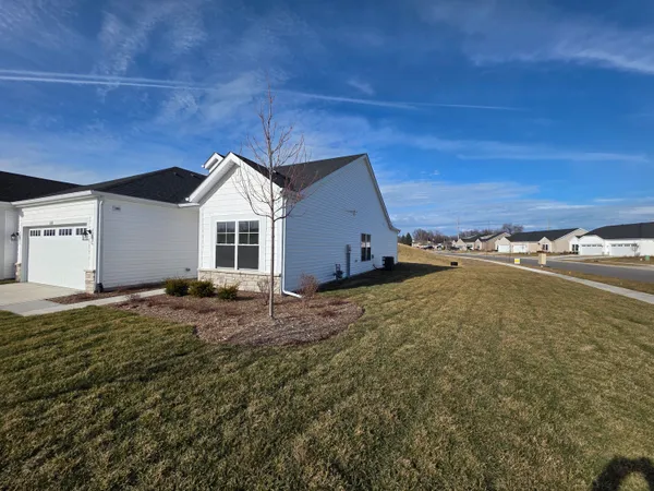 a front view of a house with a yard
