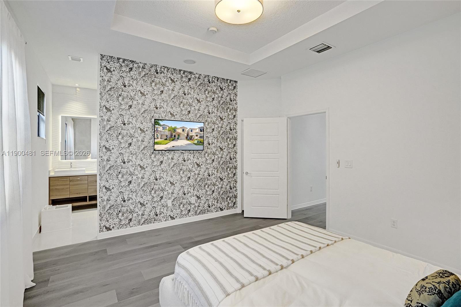 650 Northeast 193rd Terrace Miami, FL 33179 - Photo 13 of 32 a bedroom with a bed and a chair