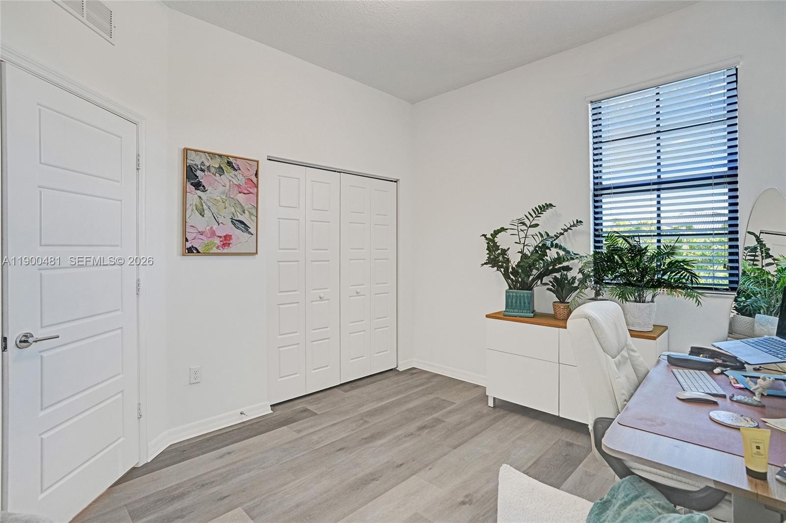 650 Northeast 193rd Terrace Miami, FL 33179 - Photo 16 of 32 a living room with furniture and flowers